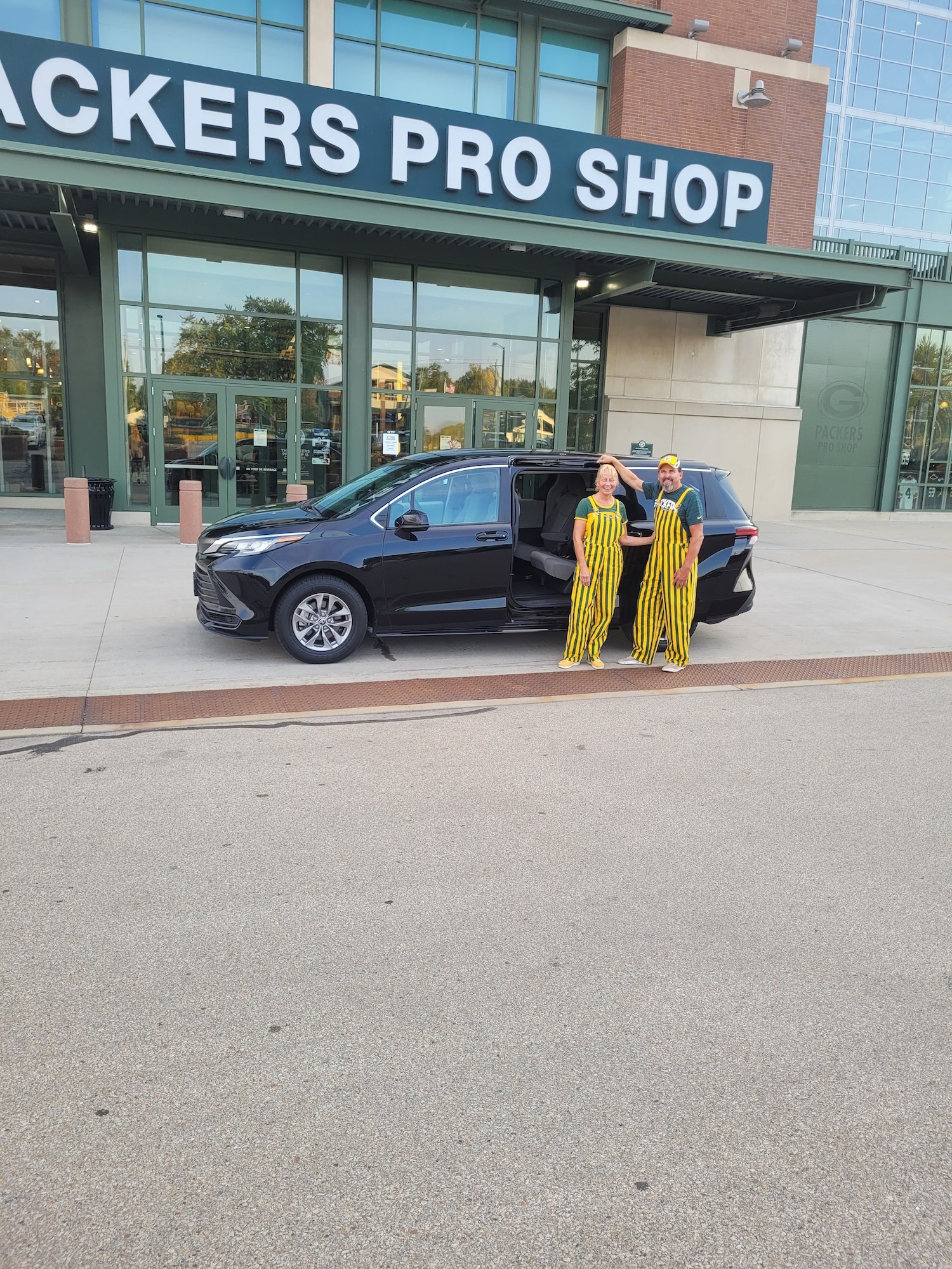 Wisconsin couple arriving at Lambeau Field in a Trusty Travels vehicle